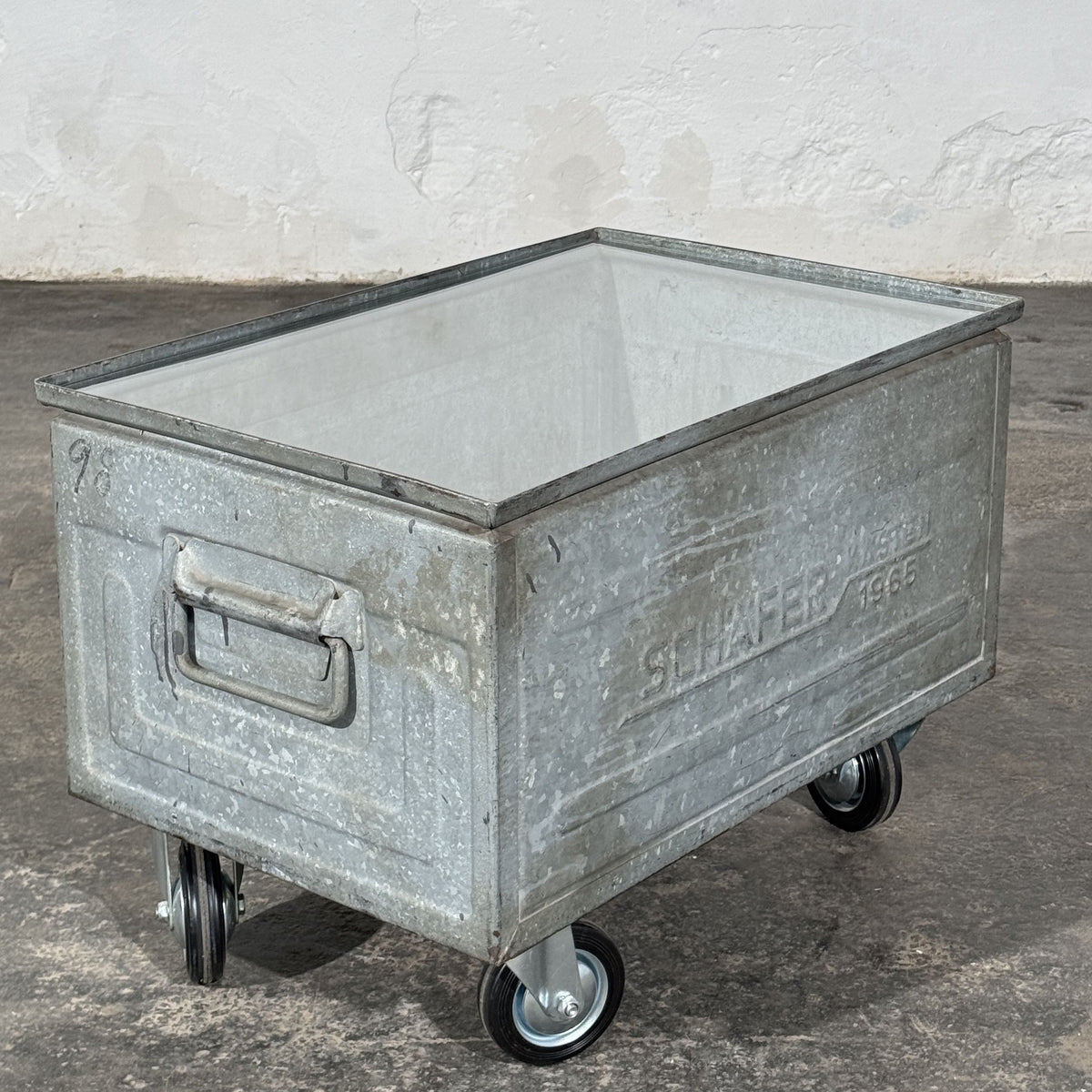 Industrial Metal Crate Coffee Table with Glass Top and Wheels, Schäfer Crate Dated 1965