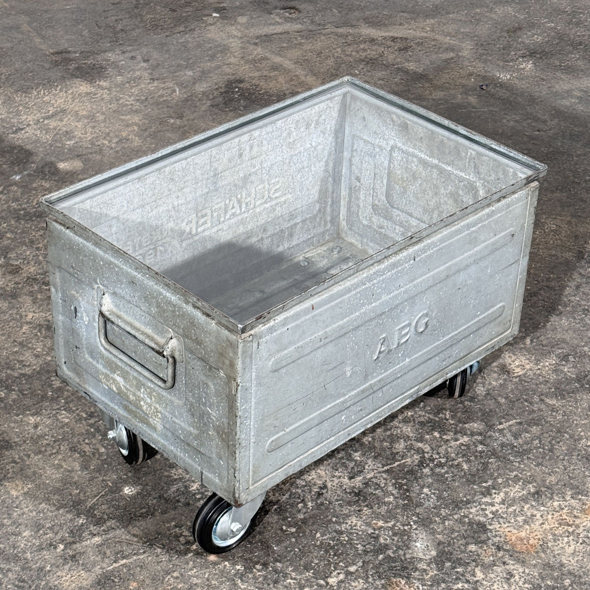 Industrial Metal Crate Coffee Table with Glass Top and Wheels, Schäfer Crate Dated 1965