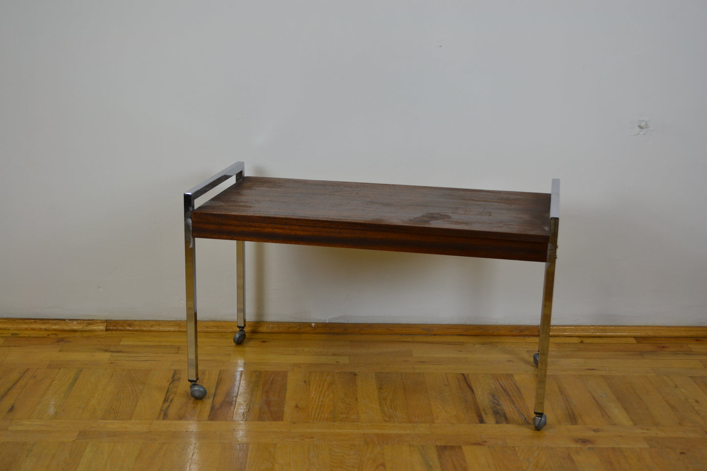 chrome structured teak coffee table on wheels