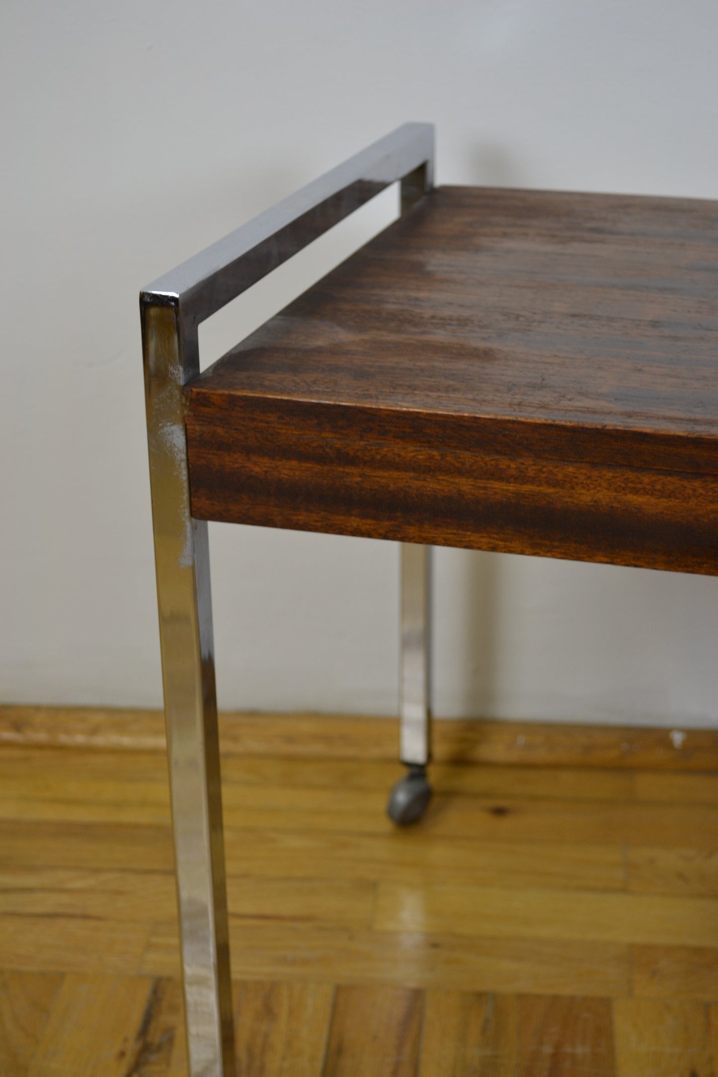 chrome structured teak coffee table on wheels