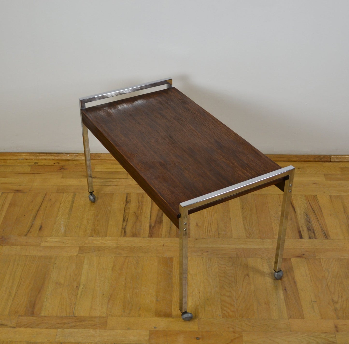 chrome structured teak coffee table on wheels